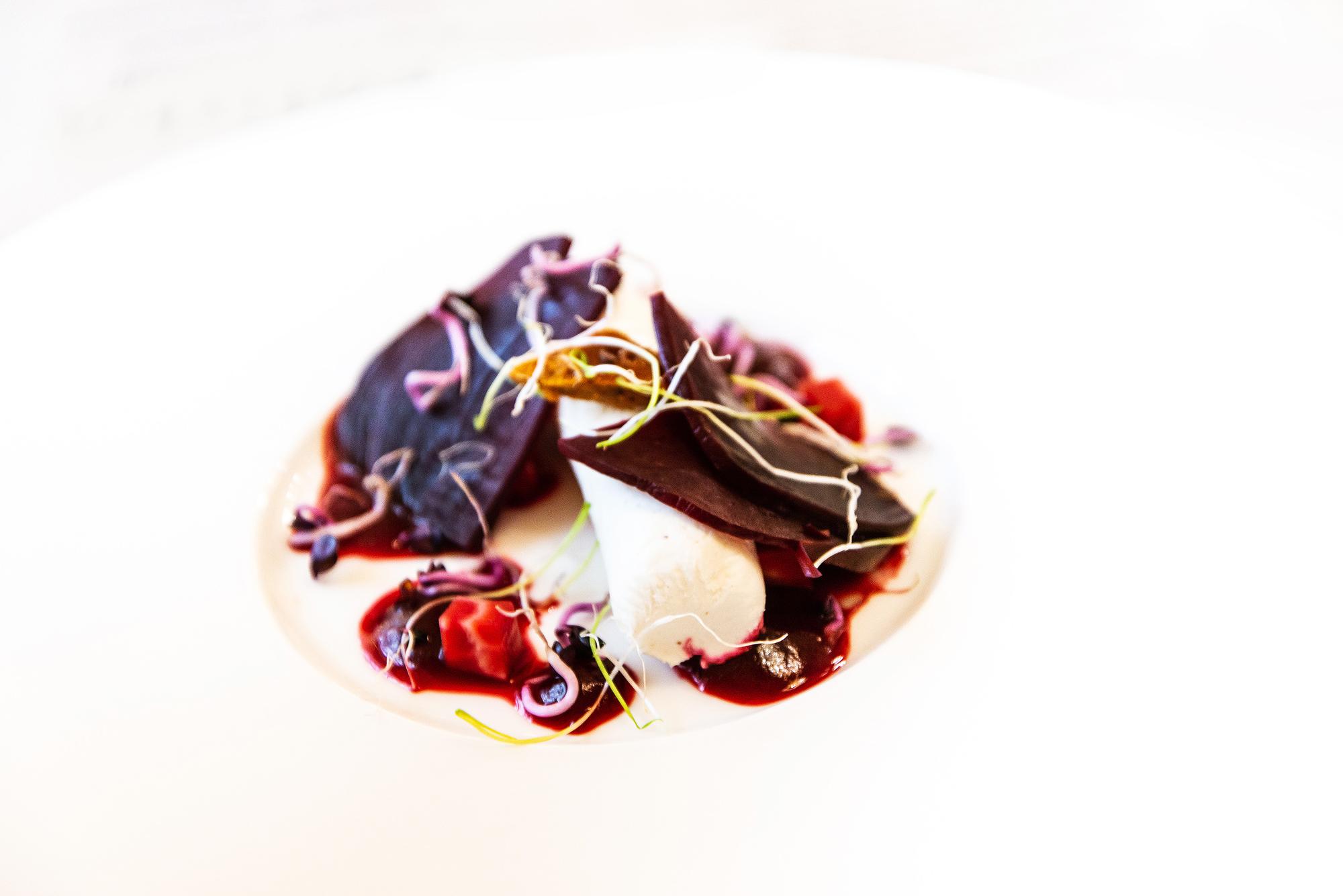 Large editorial shot of plated seasonal dish with soft background