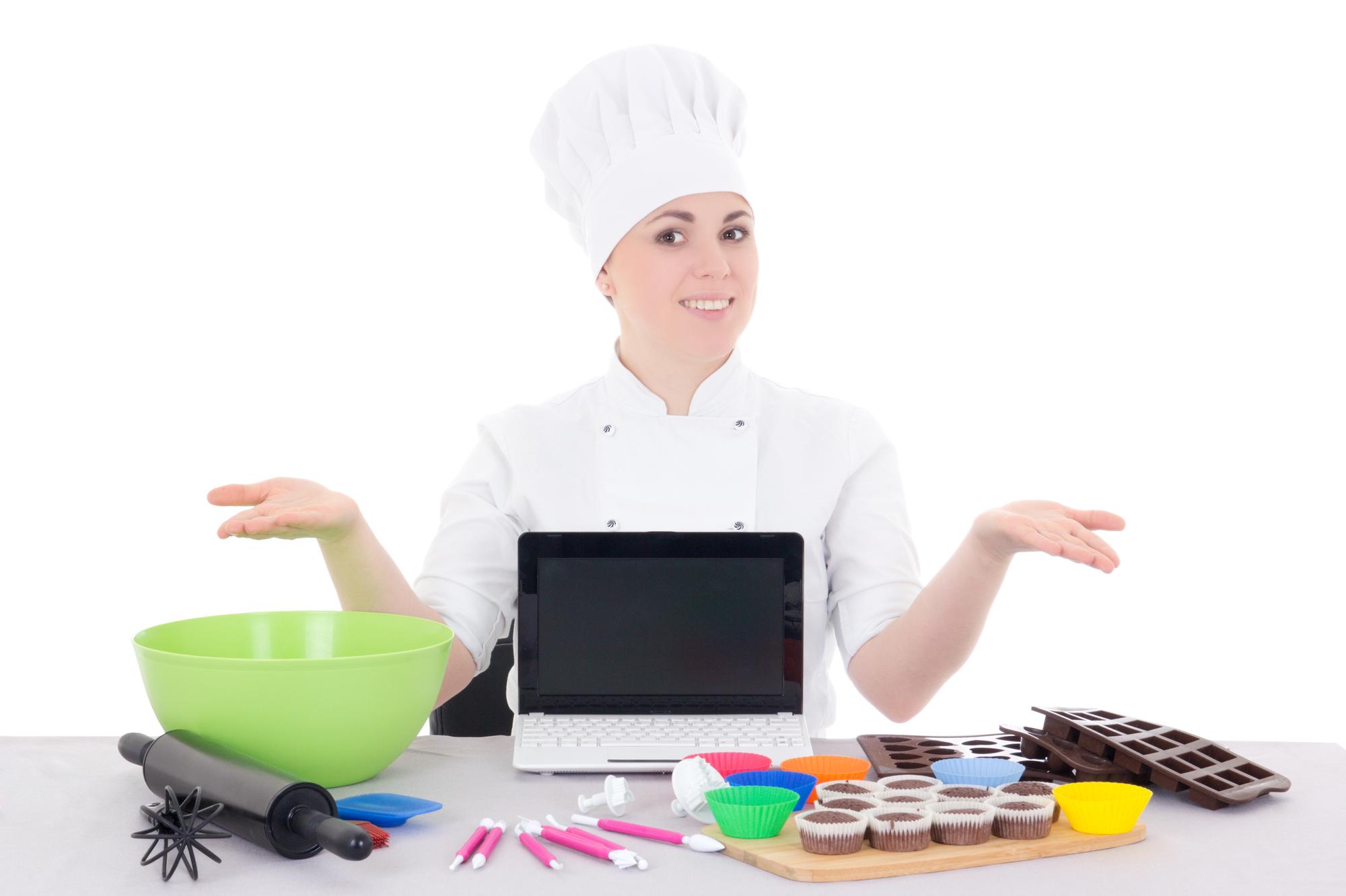 Chef teaching an online class from a warm kitchen set