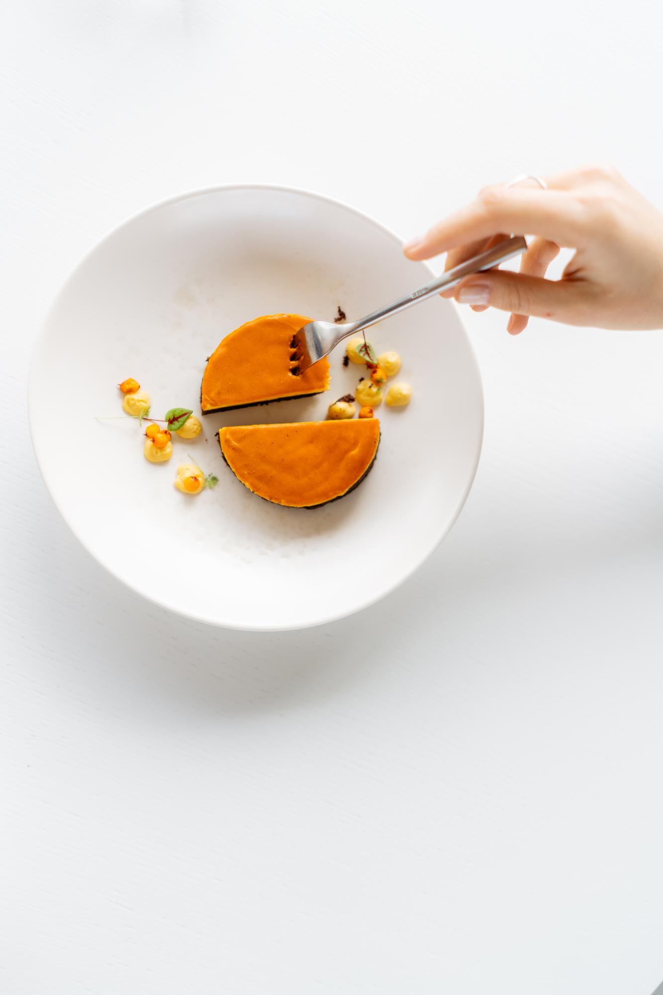 Small header photo of hands plating food